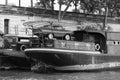 The barges are anchored at the waterfront on the river Seine. Royalty Free Stock Photo